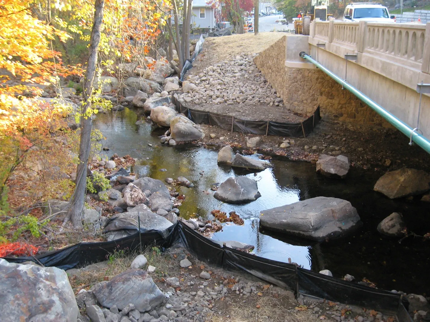 A stream with rocks and water in it.