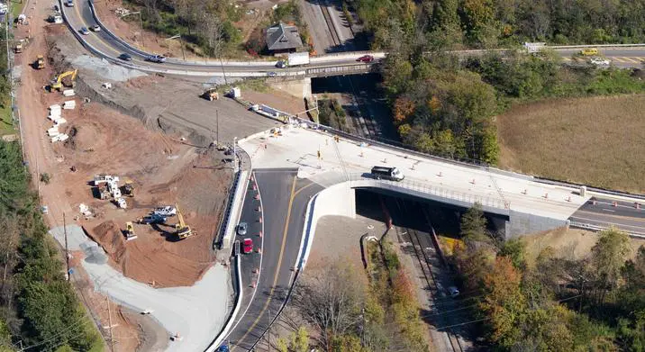 An aerial view of a highway with construction on the side.